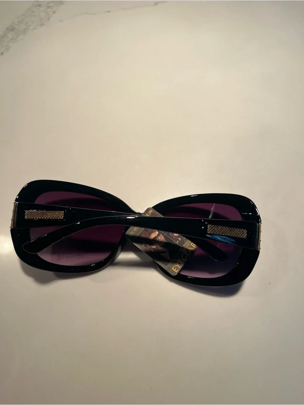 NWT fabulous oversized black sunglasses with gold tone design on front & sides.